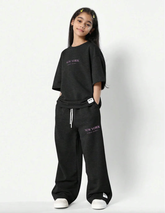 Trendy girls' leopard print oversized t-shirt and matching loose fit trousers for a bold, comfy look