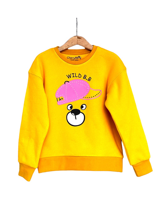 Yellow sweatshirt with cartoon bear design and text on a white background